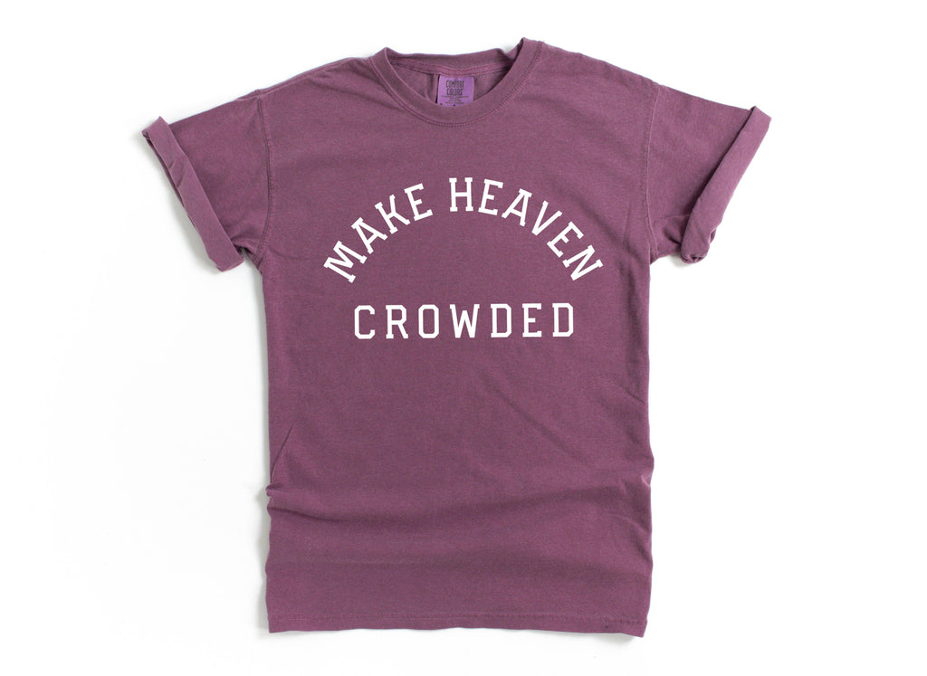 Purple T-shirt with “Make Heaven Crowded” graphic on front