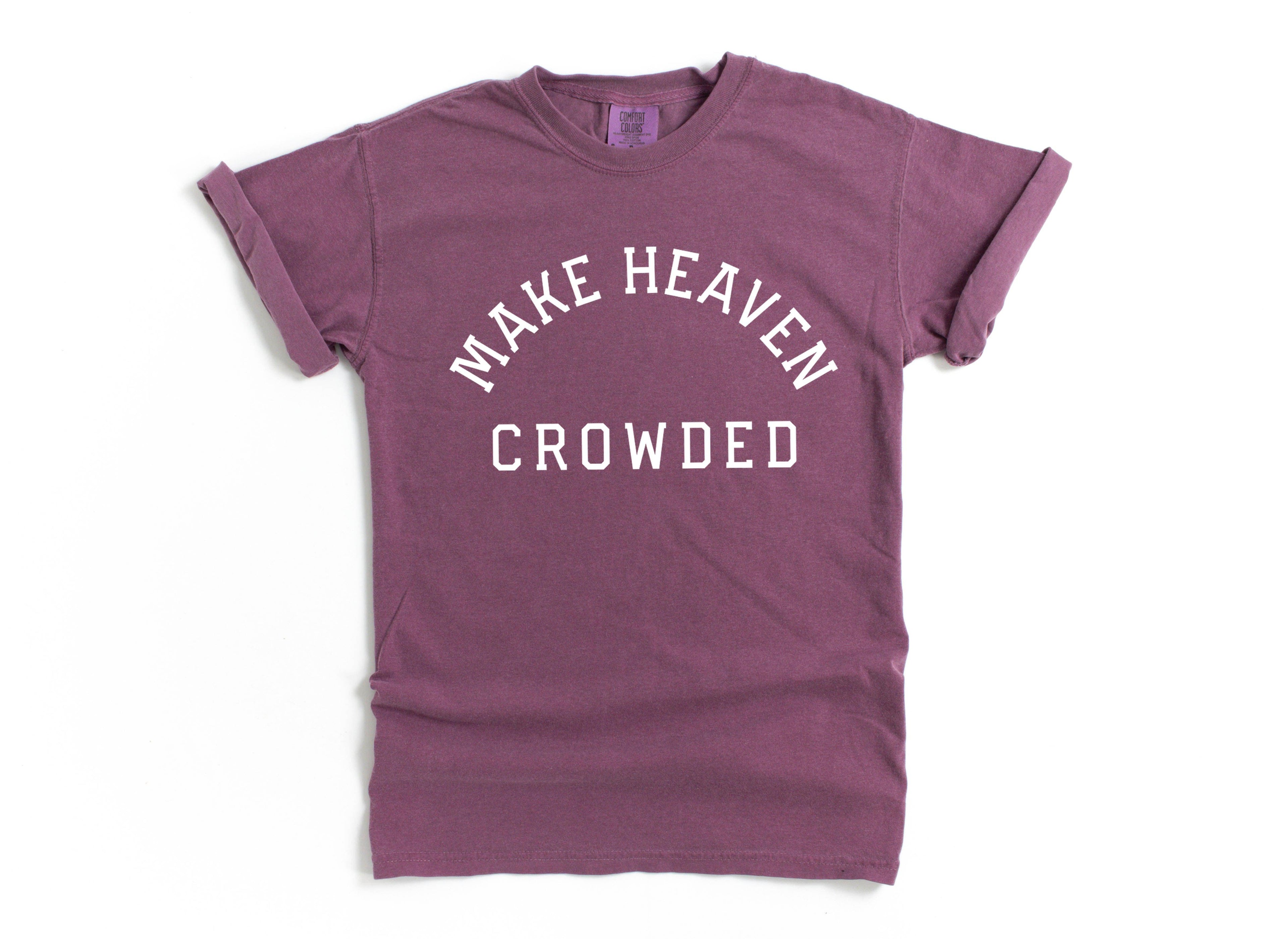 Purple T-shirt with “Make Heaven Crowded” graphic on front