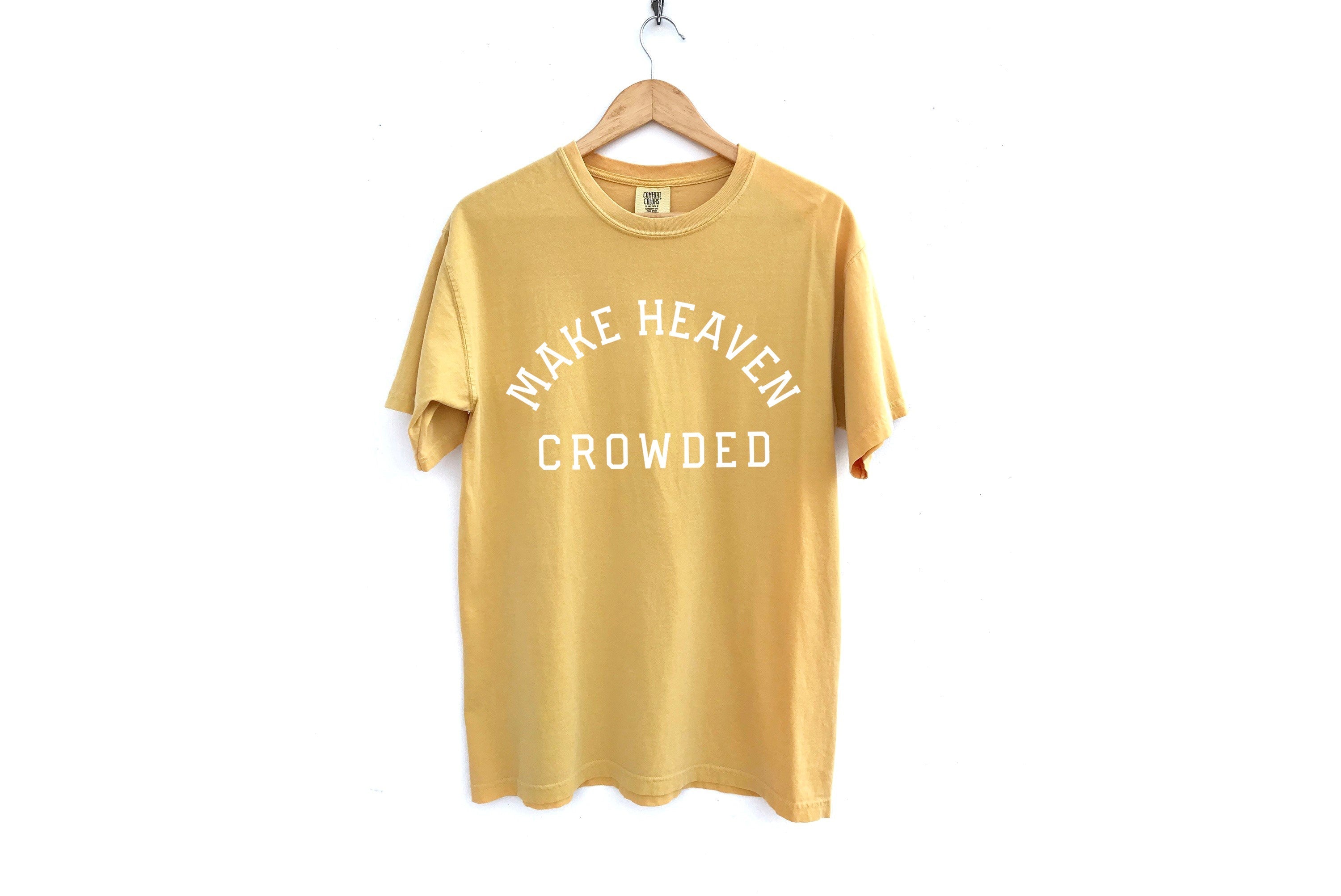 Mustard yellow T-shirt with “Make Heaven Crowded” graphic on front