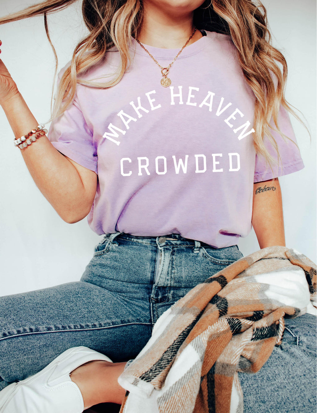 Light lavender T-shirt with “Make Heaven Crowded” graphic on front
