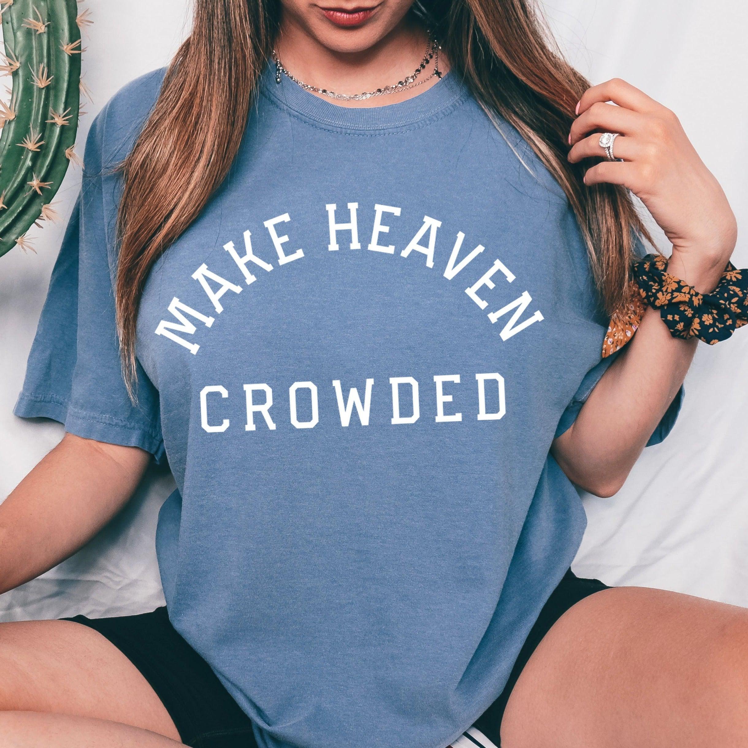 Blue T-shirt with “Make Heaven Crowded” graphic on front