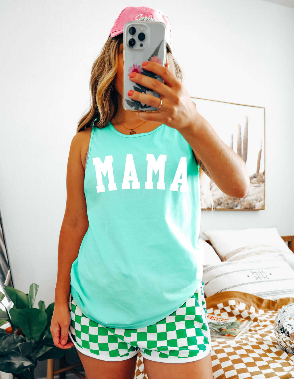 Turquoise sleeveless tank top with large white 'MAMA' print, condensed fit
