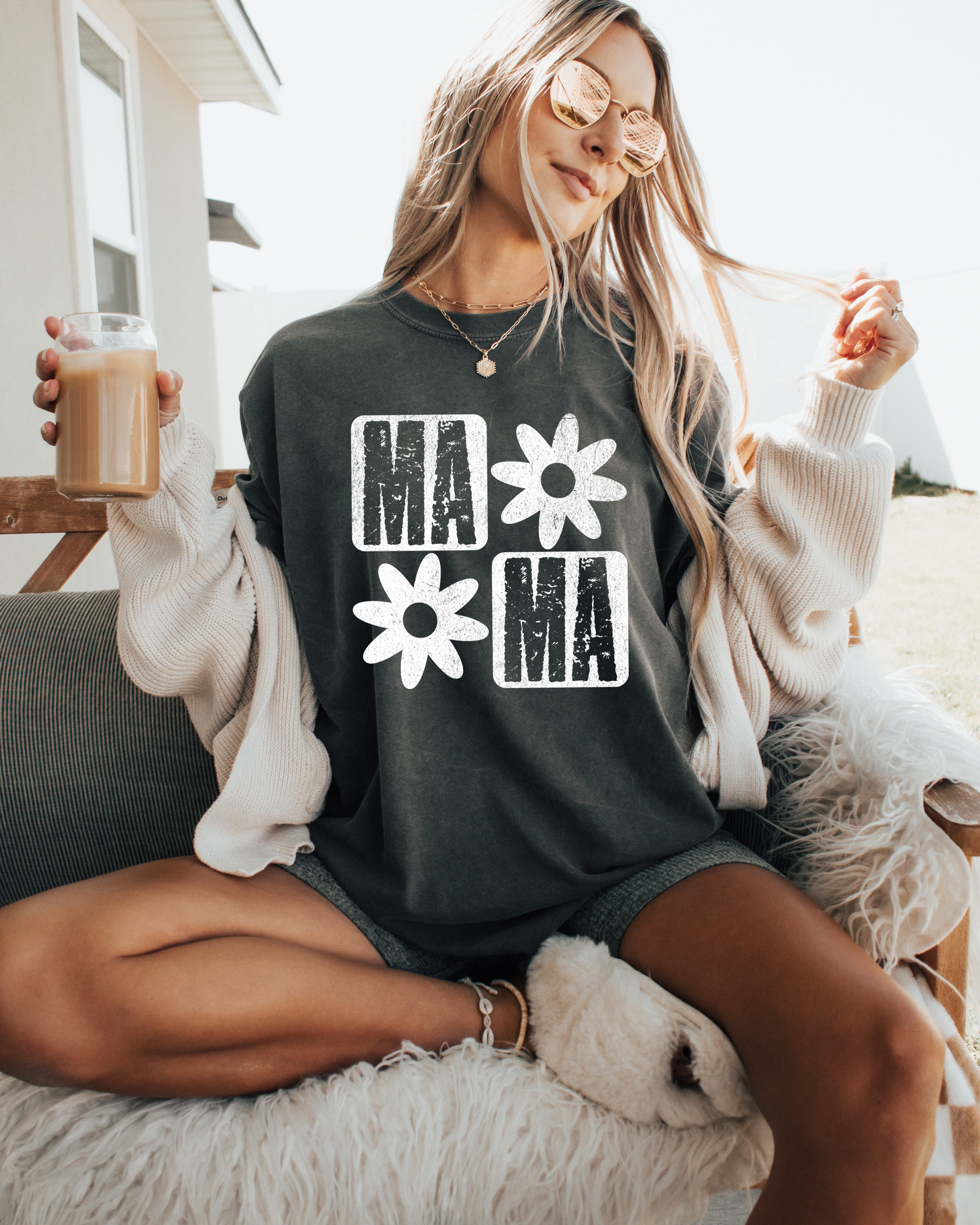 Black short-sleeve T-shirt with white "MA" and flower graphic front