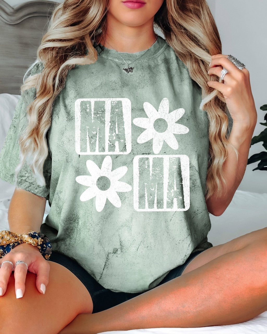 Moss green short-sleeve T-shirt with white "MA" and flower graphic