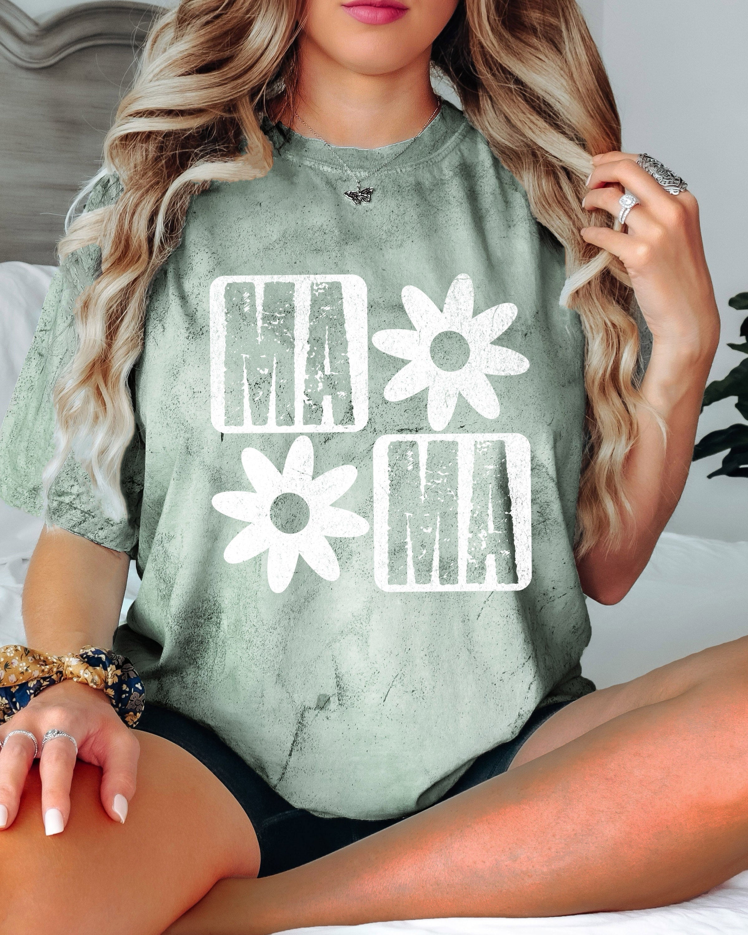 Moss green short-sleeve T-shirt with white "MA" and flower graphic