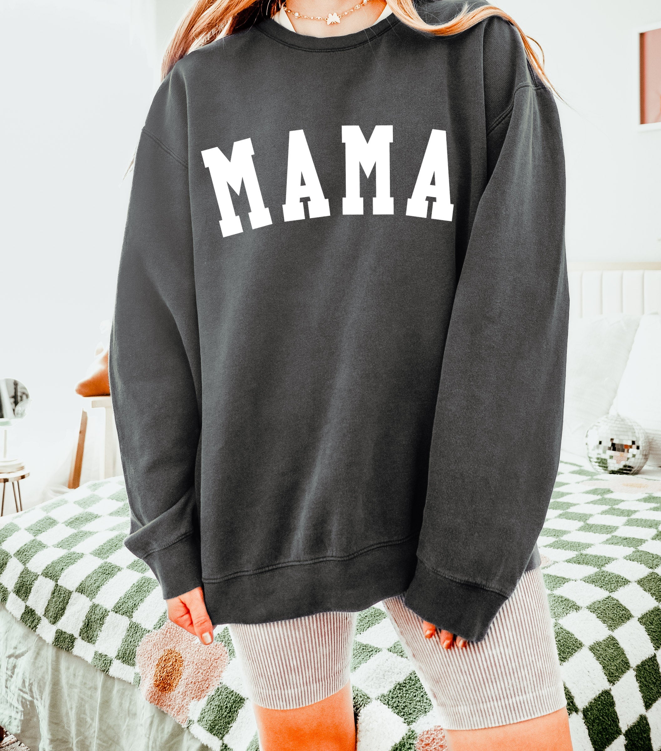 Dark gray unisex crewneck sweatshirt with large front print reading "MAMA"