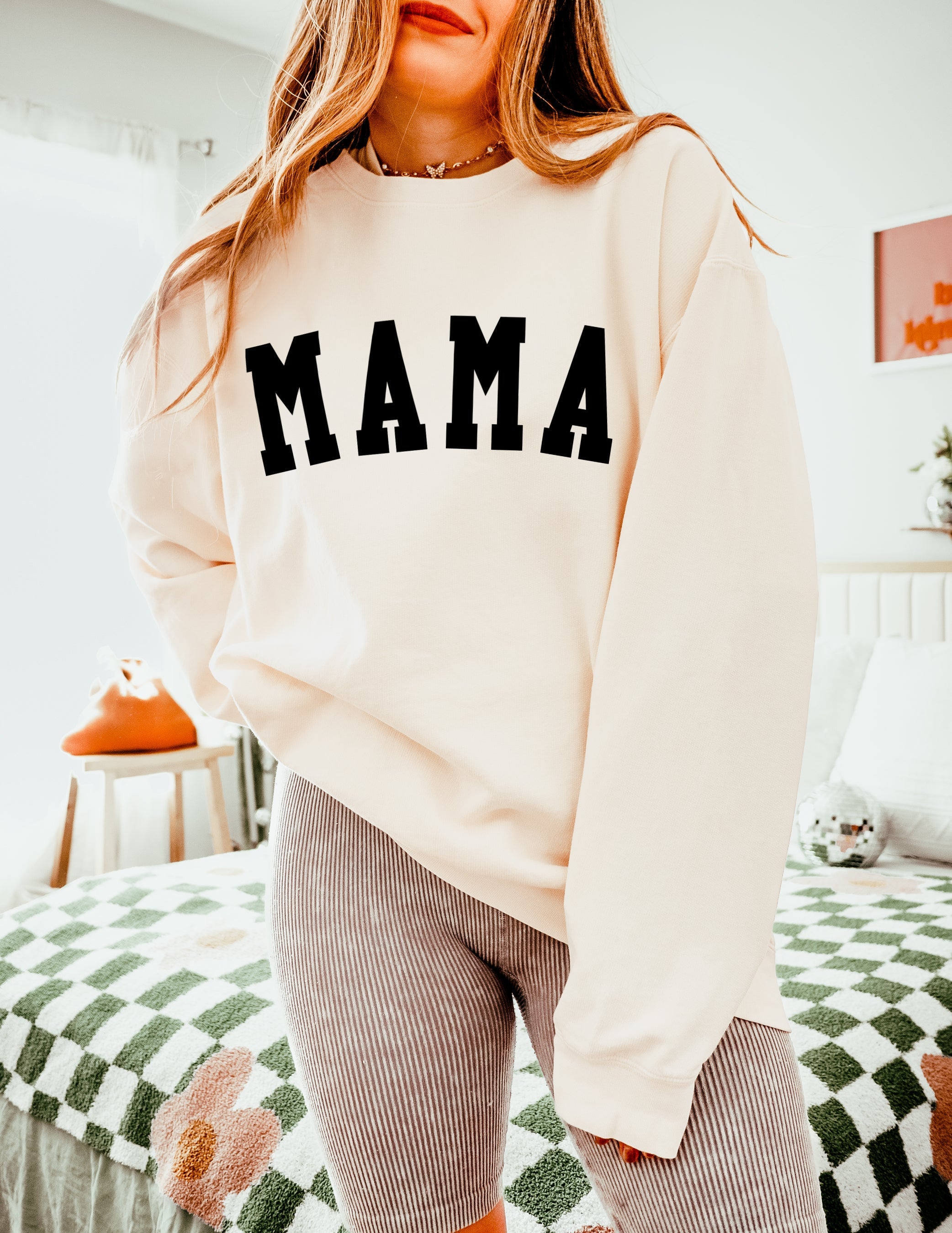 Ivory unisex crewneck sweatshirt with large front print reading "MAMA"