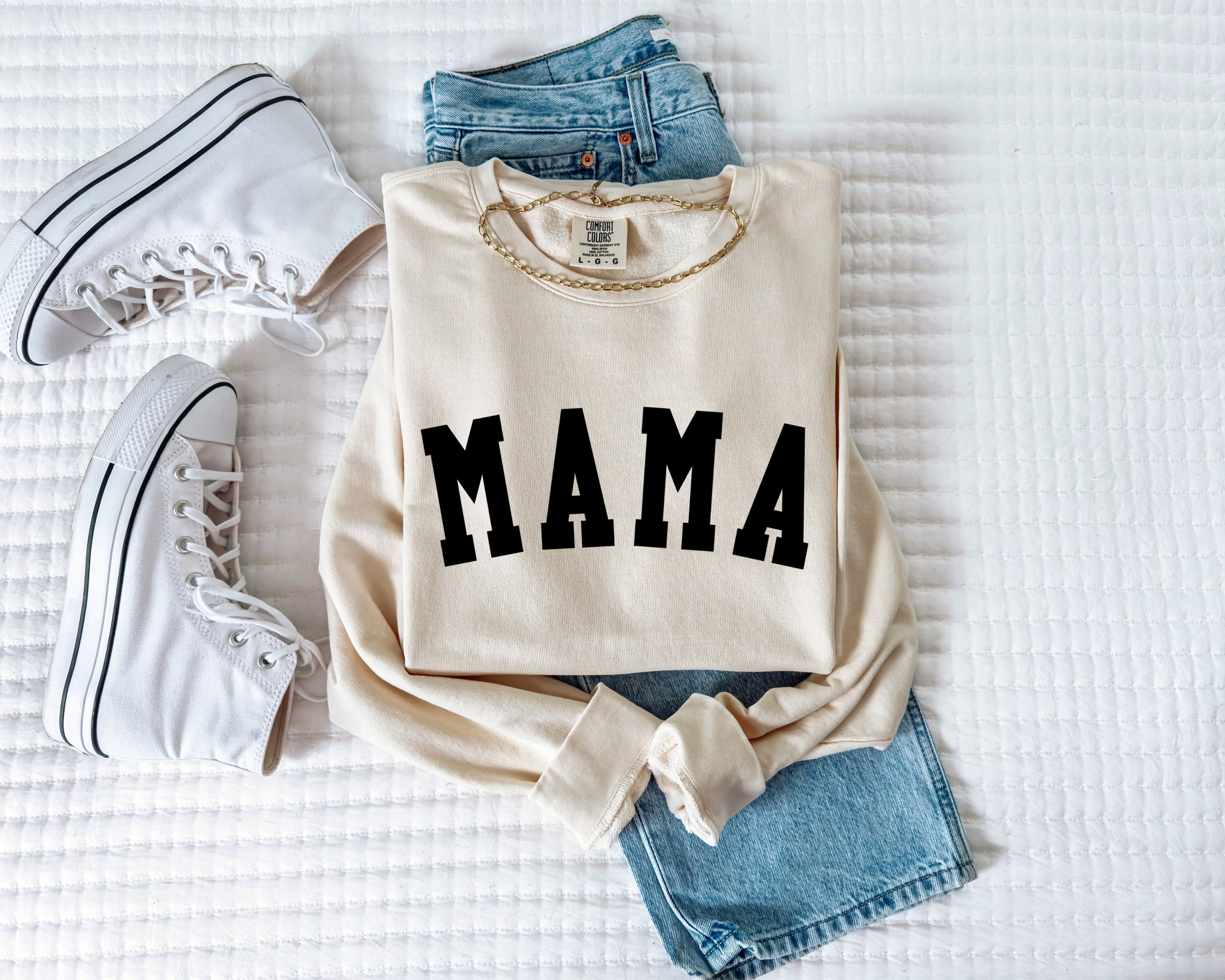 Cream unisex crewneck sweatshirt with bold front print reading "MAMA"