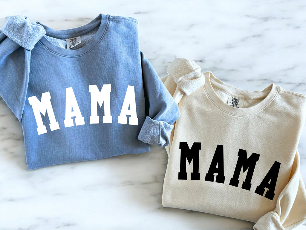 Light blue and cream unisex crewneck sweatshirts, each with front print reading "MAMA"