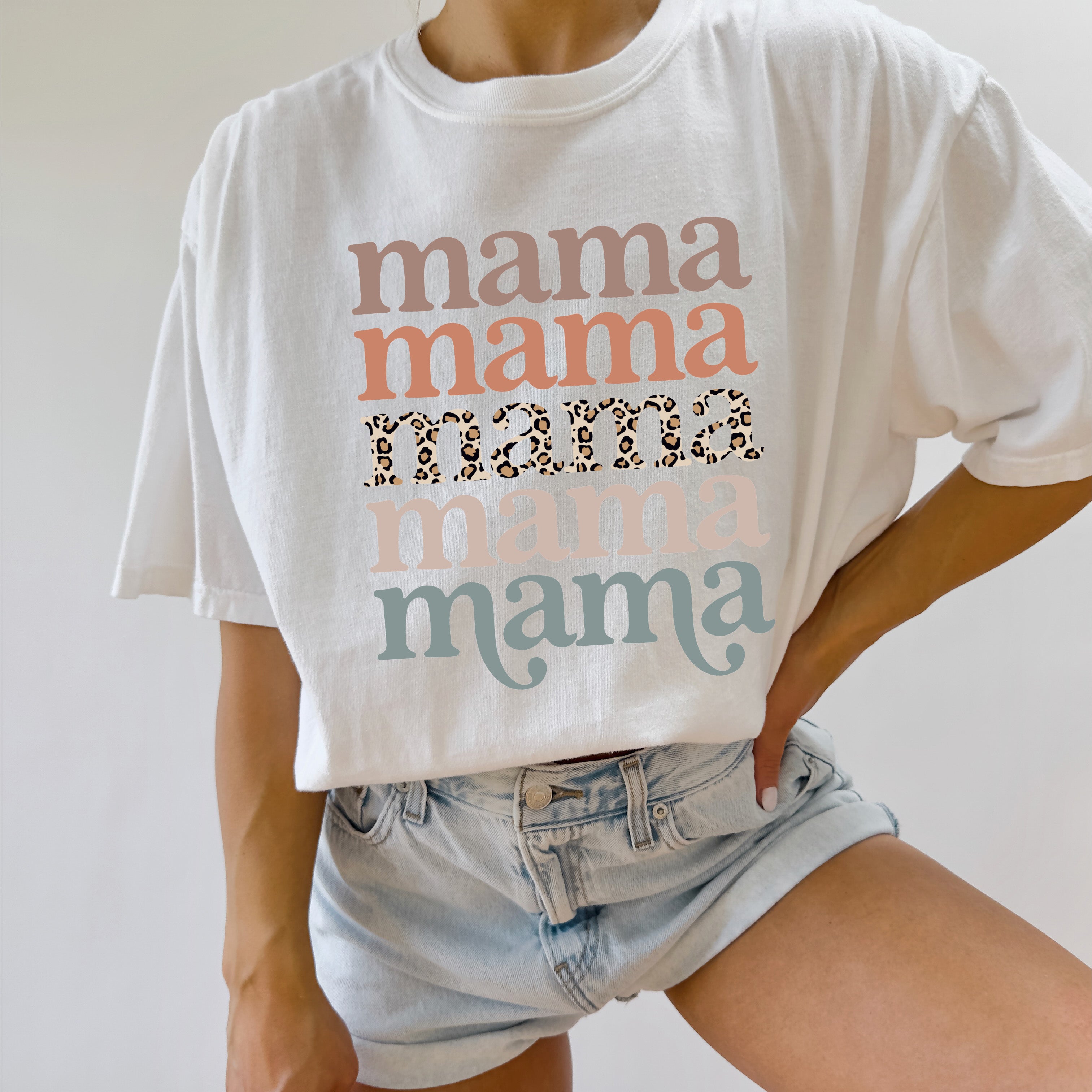 White Mama graphic T-shirt with stacked “mama” text and leopard print stripe