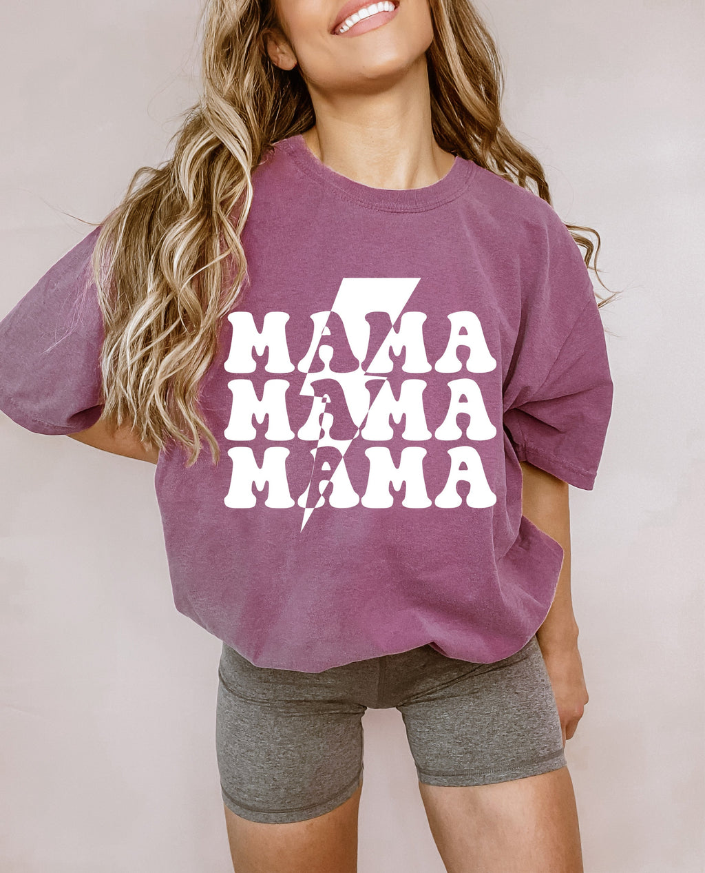 Mauve unisex T-shirt with distressed white 'MAMA' graphic on the front.
