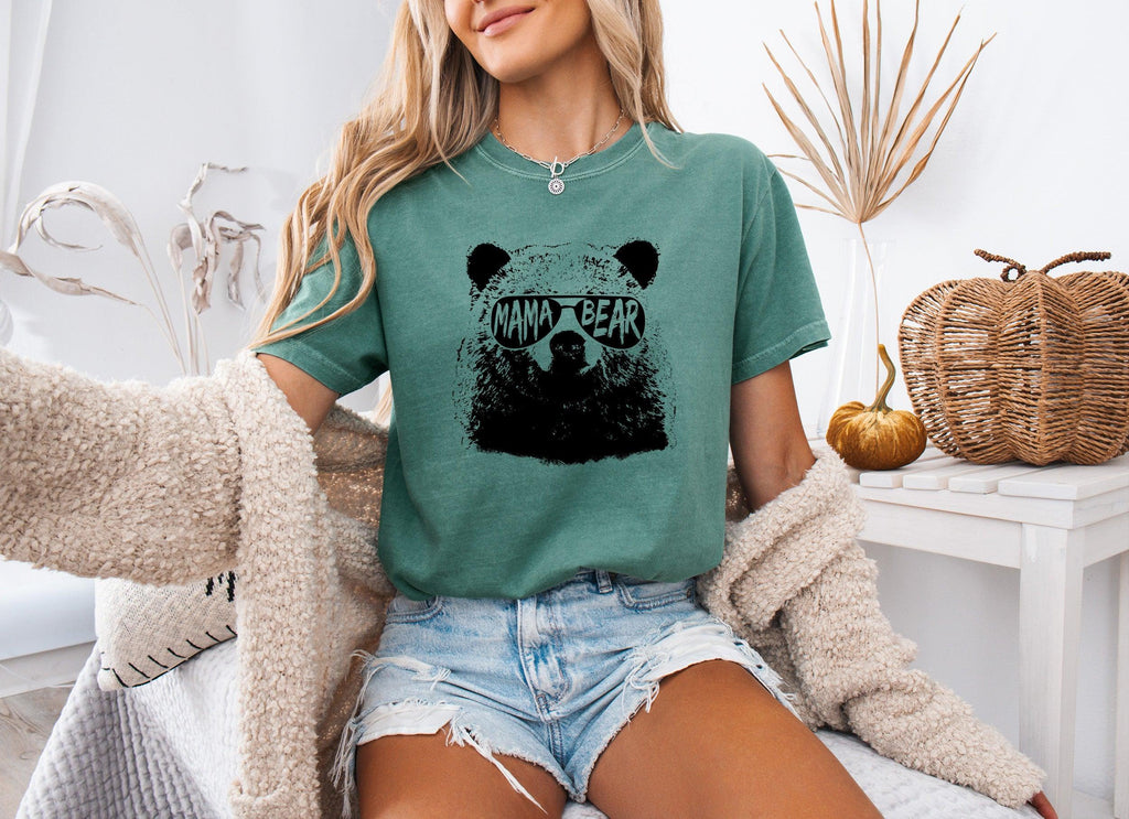Green garment-dyed T-shirt with black bear face graphic, short sleeves, crew neck.