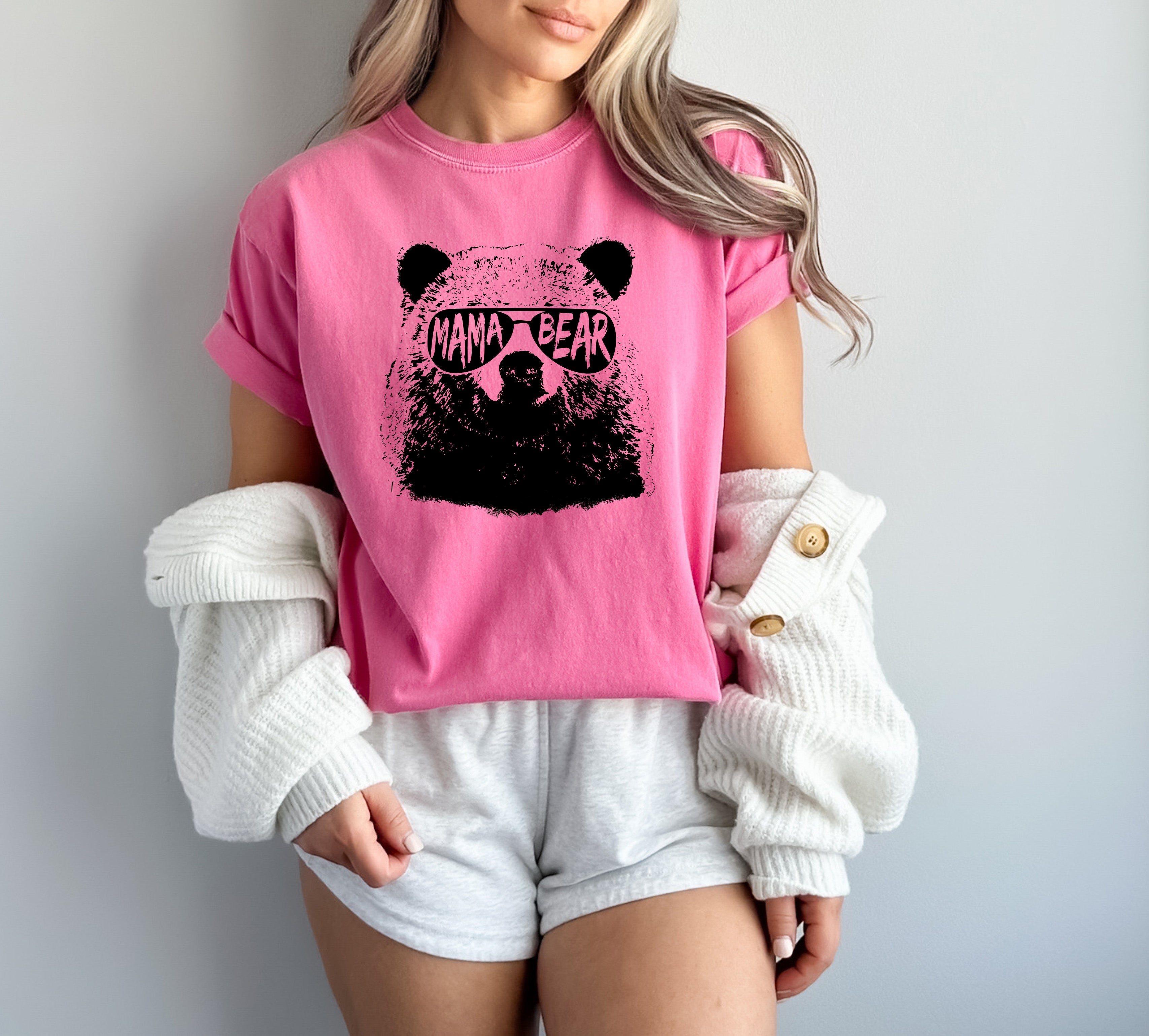 Pink garment-dyed T-shirt with black bear face graphic, short sleeves, crew neck.