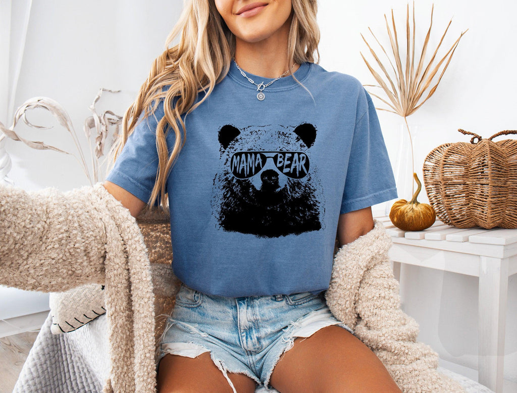 Blue garment-dyed T-shirt with black bear face graphic, short sleeves, crew neck.