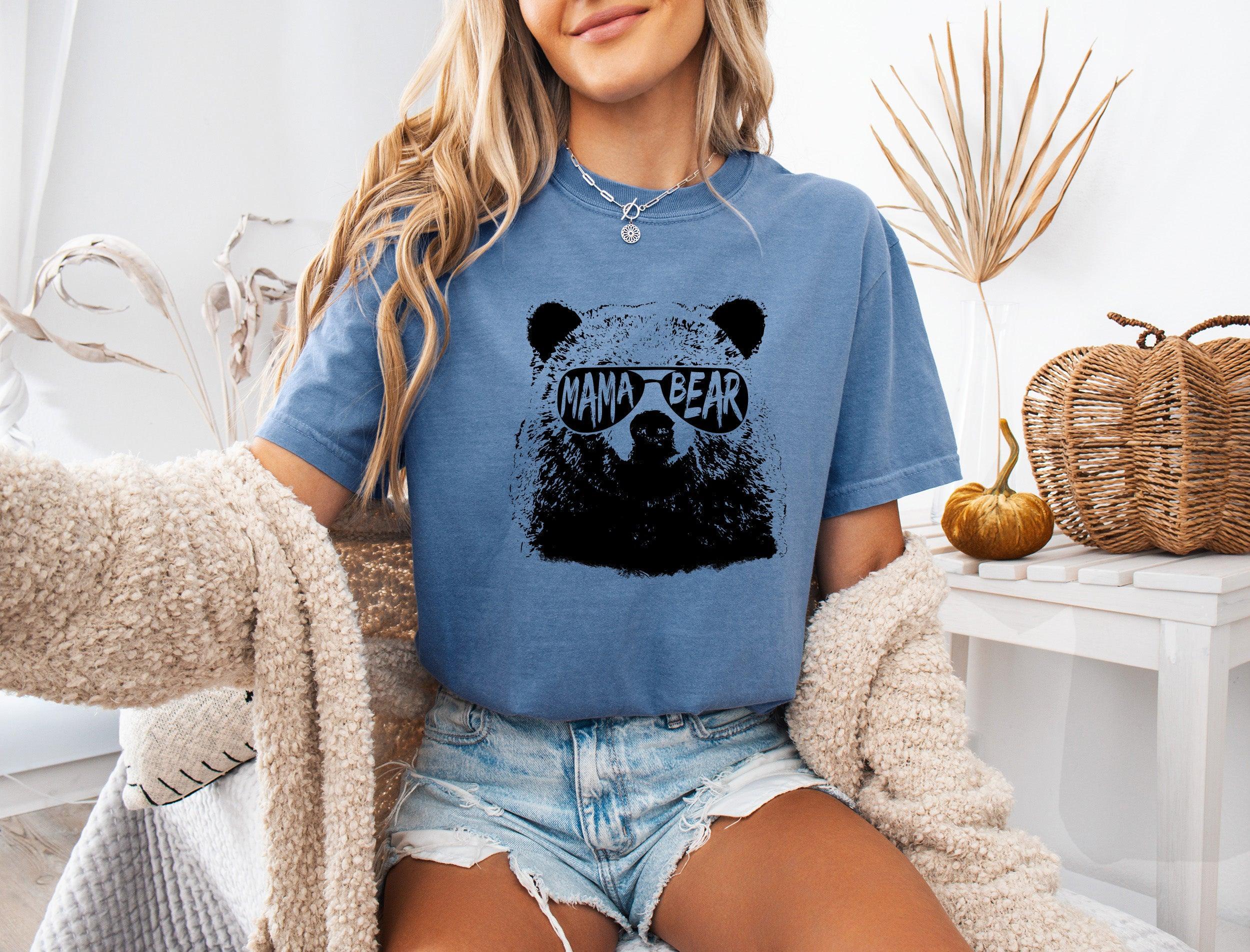 Blue garment-dyed T-shirt with black bear face graphic, short sleeves, crew neck.