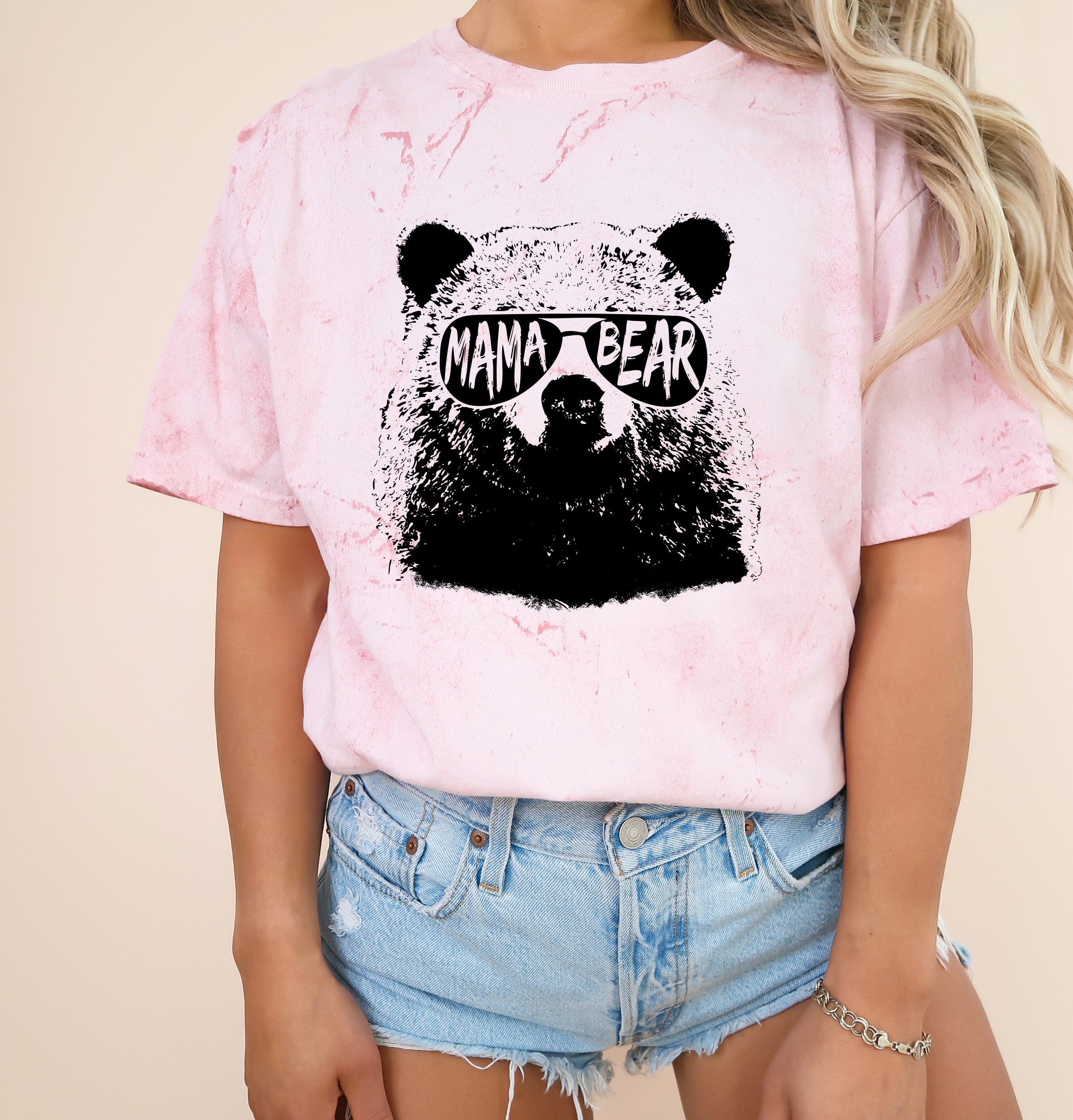 Garment-dyed T-shirt in light pink with black bear graphic on the chest