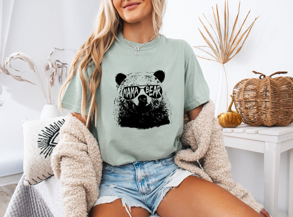 Garment-dyed T-shirt in sage green with black bear graphic on the chest