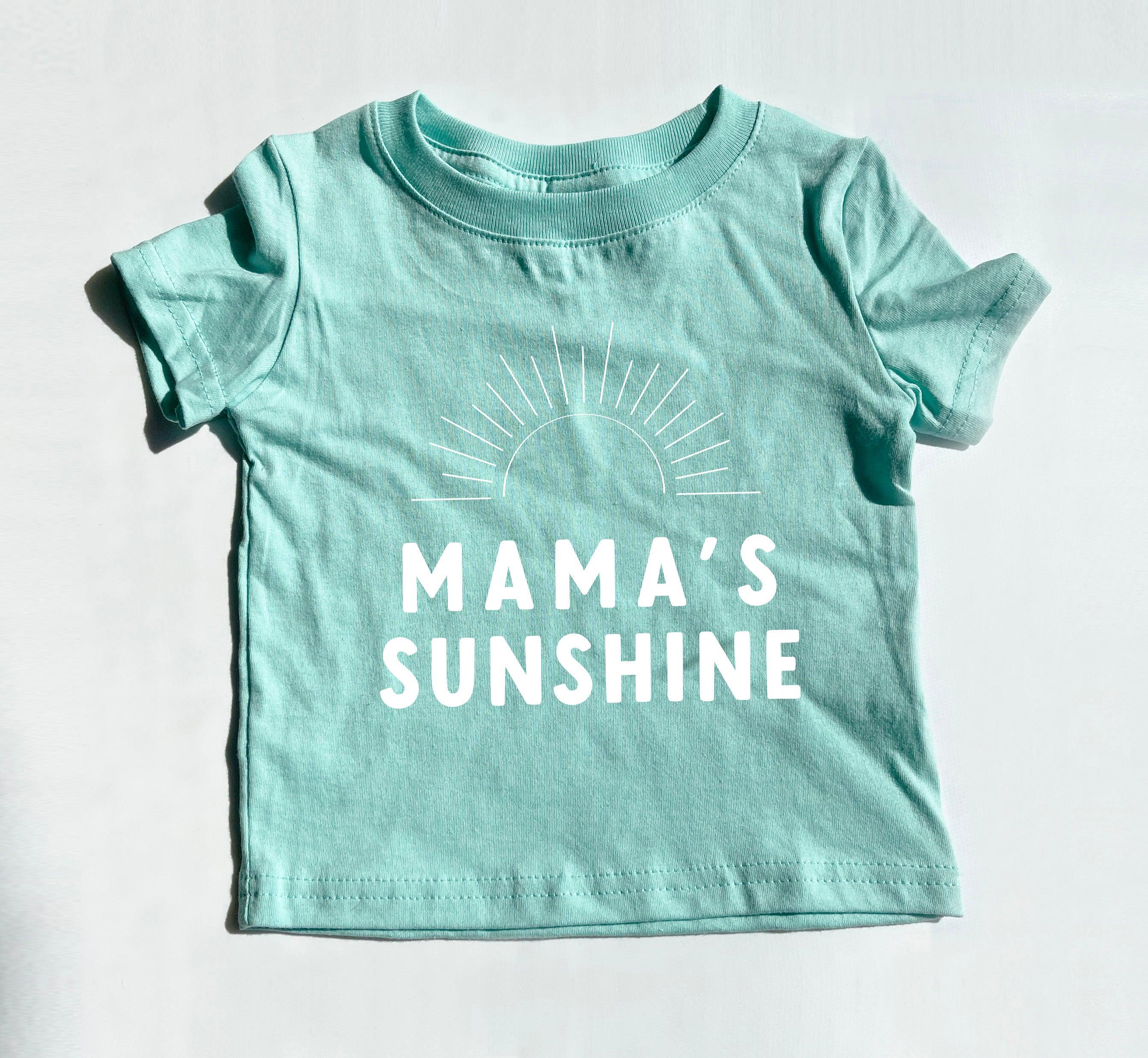 Teal baby T-shirt with 'MAMA'S SUNSHINE' lettering and sunburst graphic