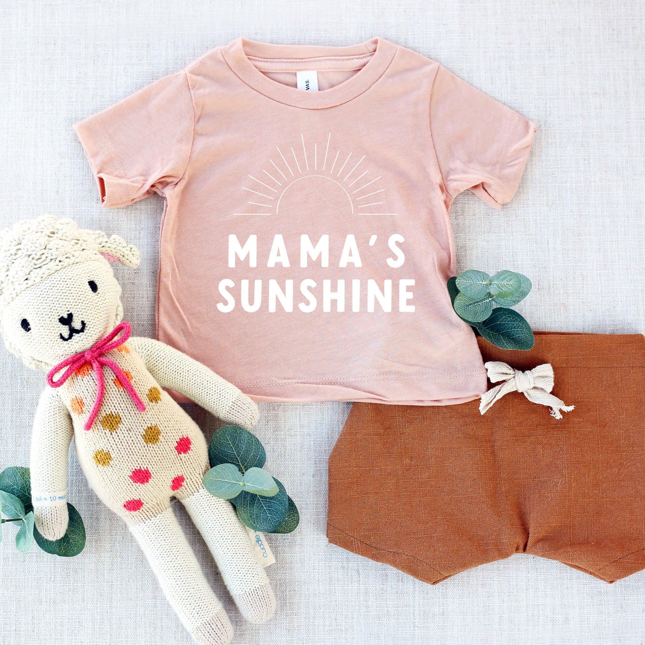 Pink baby and toddler T-shirt with “Mama’s Sunshine” sun graphic