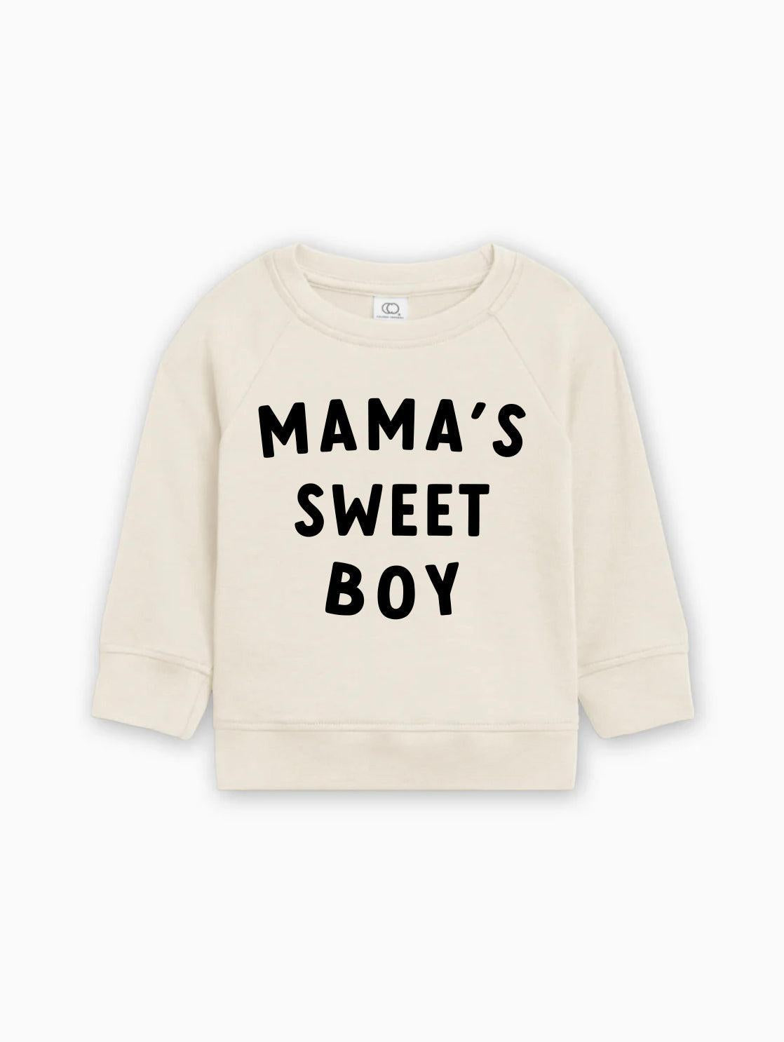 Baby pullover in natural cream with black “MAMA’S SWEET BOY” lettering on front.