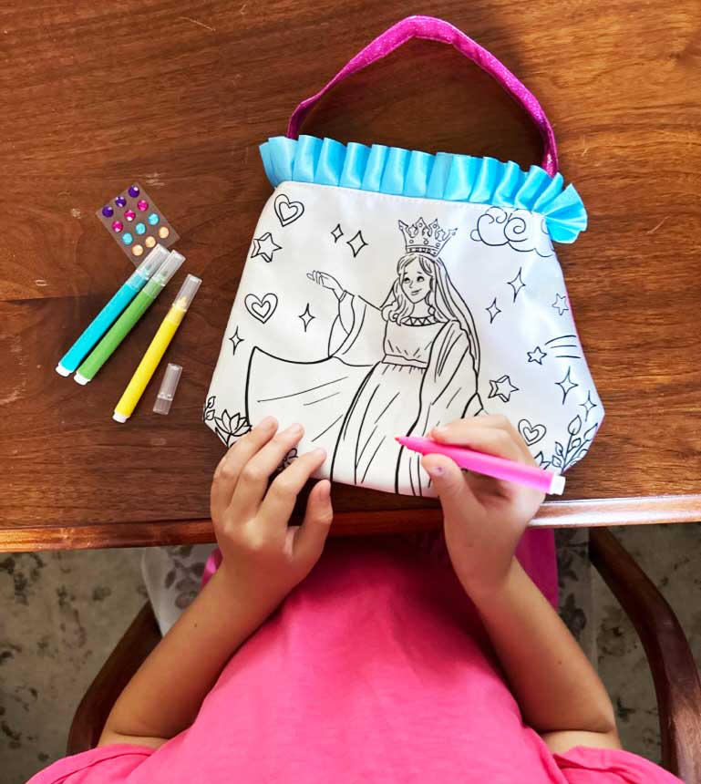 Mary illustration color and pray purse with blue ruffle trim, shown with markers