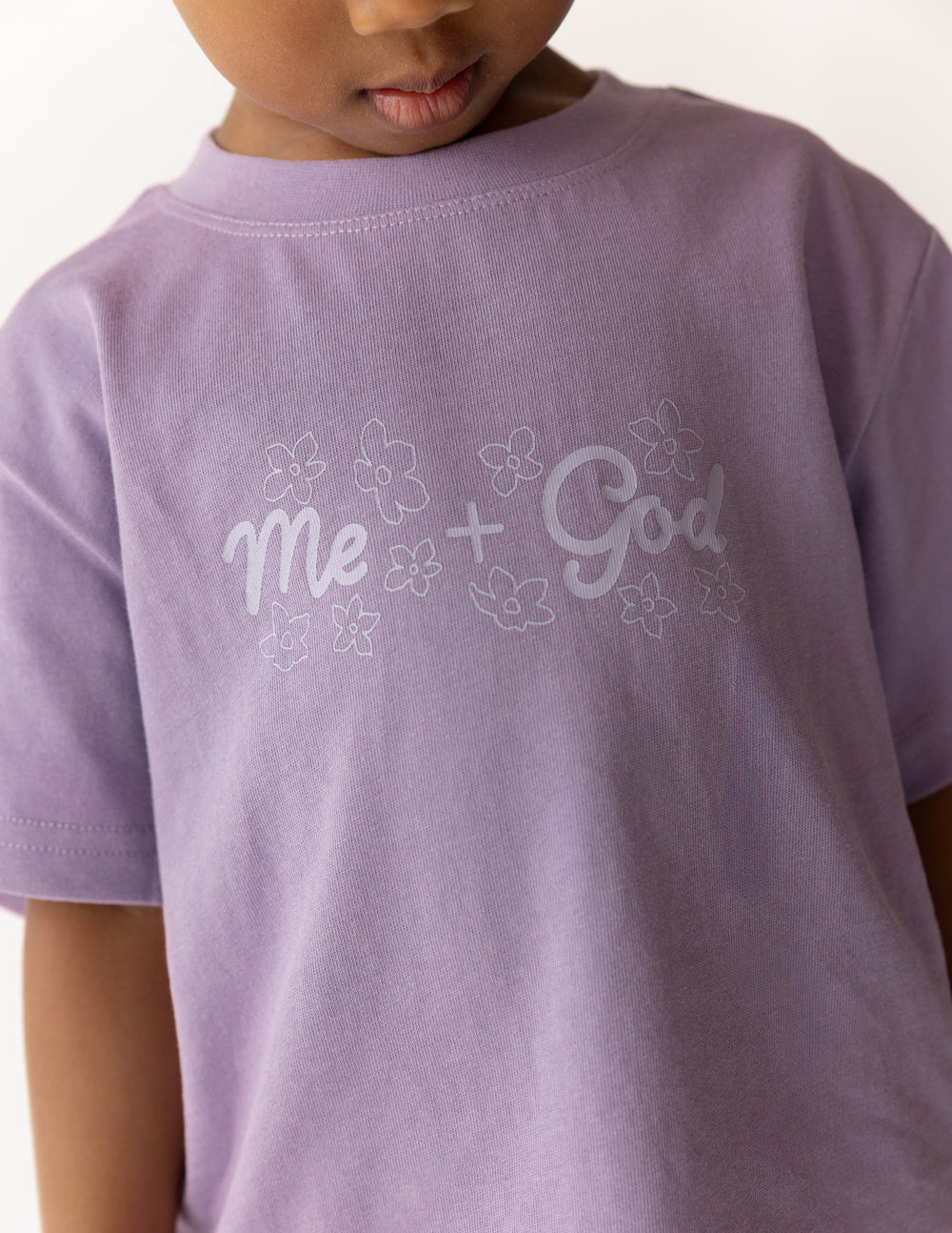 Kids lavender T-shirt neckline and 'Me + God' floral graphic detail