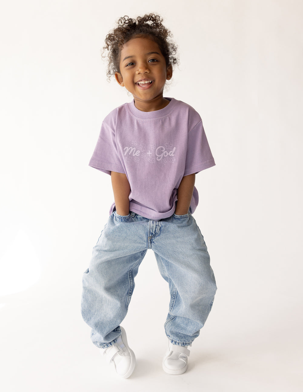 Kids lavender T-shirt with 'Me + God' graphic and short sleeves