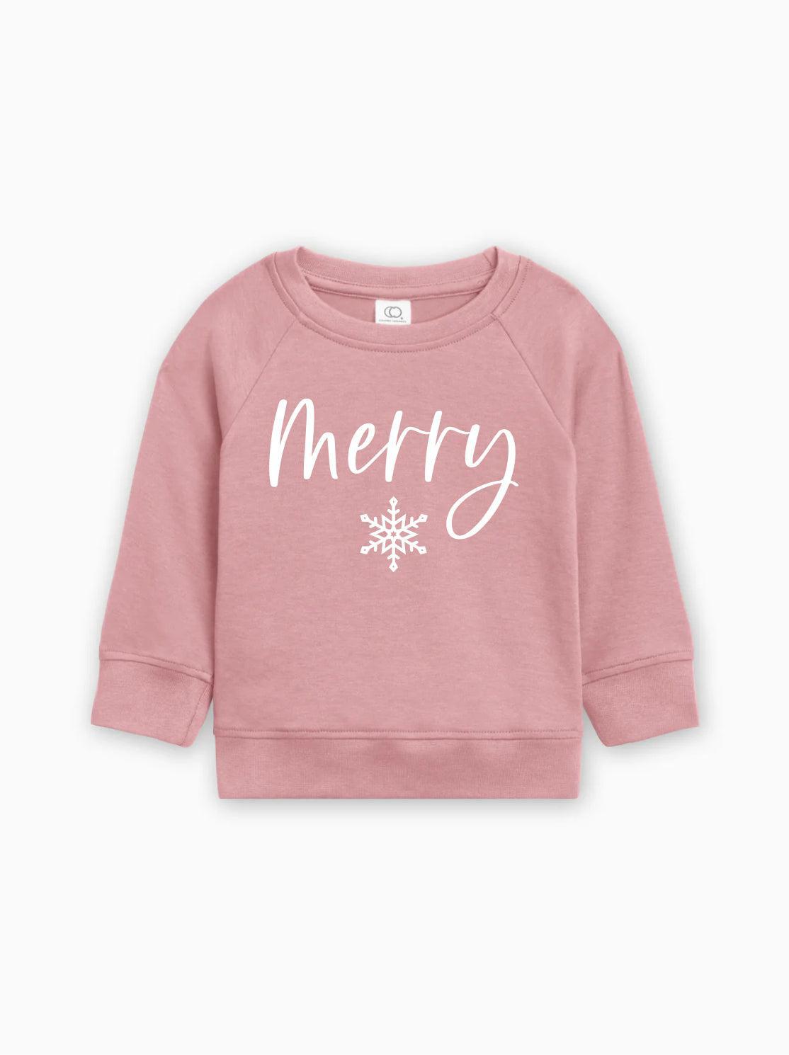 Pink organic cotton baby pullover with 'Merry' script and white snowflake graphic