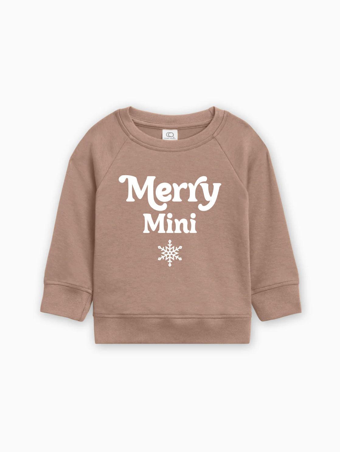 Camel brown baby pullover sweatshirt with “Merry Mini” text and snowflake graphic