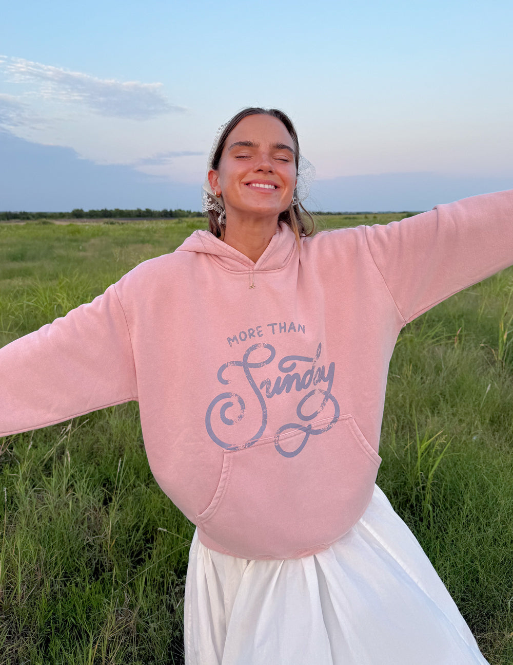 Unisex pink hoodie with hood and front graphic print, long sleeves