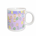 Ceramic mug with Easter egg print and white handle, pastel purple egg pattern