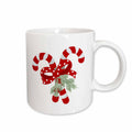 White ceramic mug with crossed peppermint candy cane holiday graphic and pine sprig