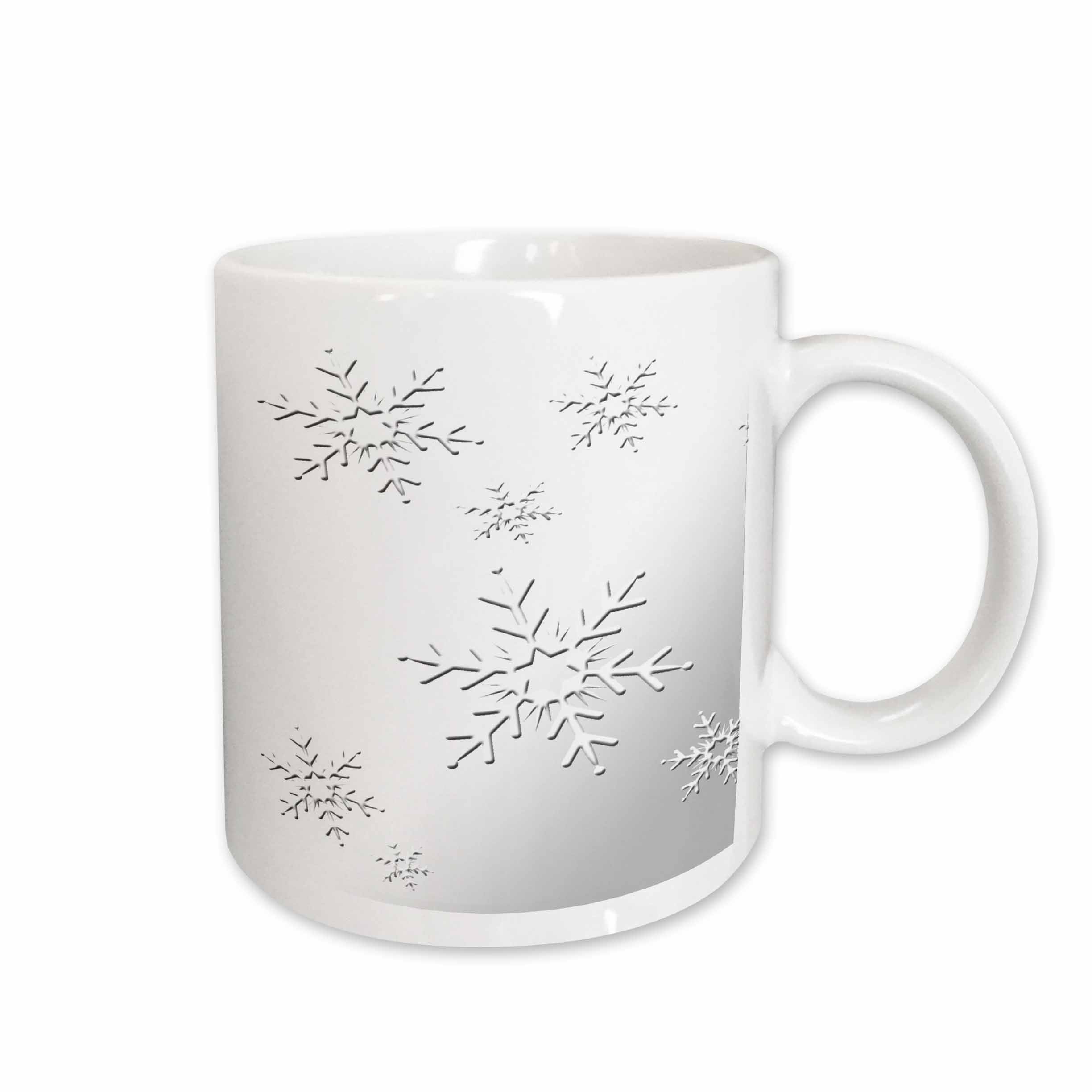 White ceramic mug with black snowflake design and curved handle