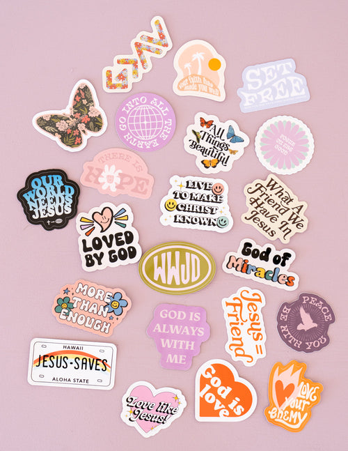 Assorted Christian stickers with 'Loved by God' and 'God is' icons in various shapes