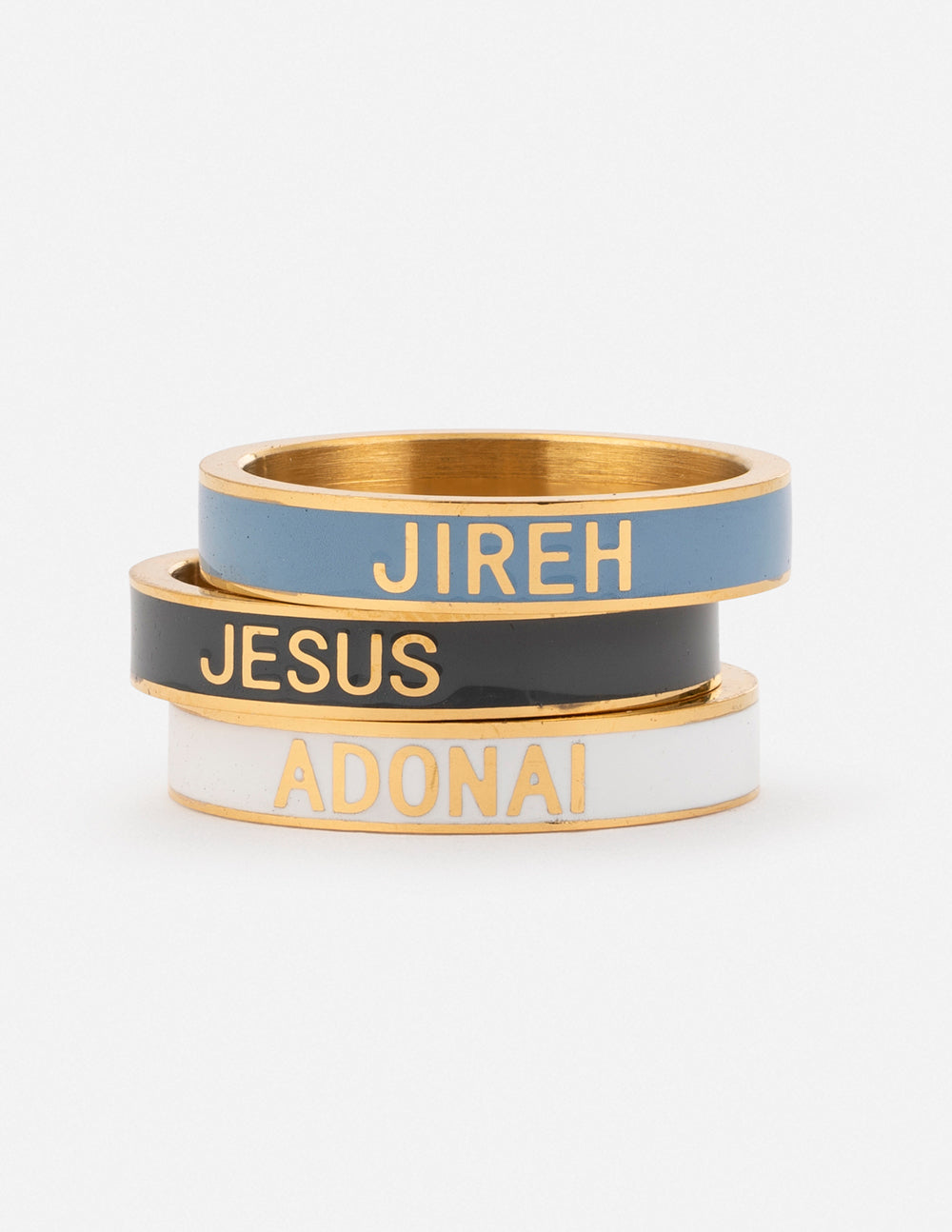 Enamel ring set of two stacked bands: blue JIREH, black JESUS, gold-tone edges.