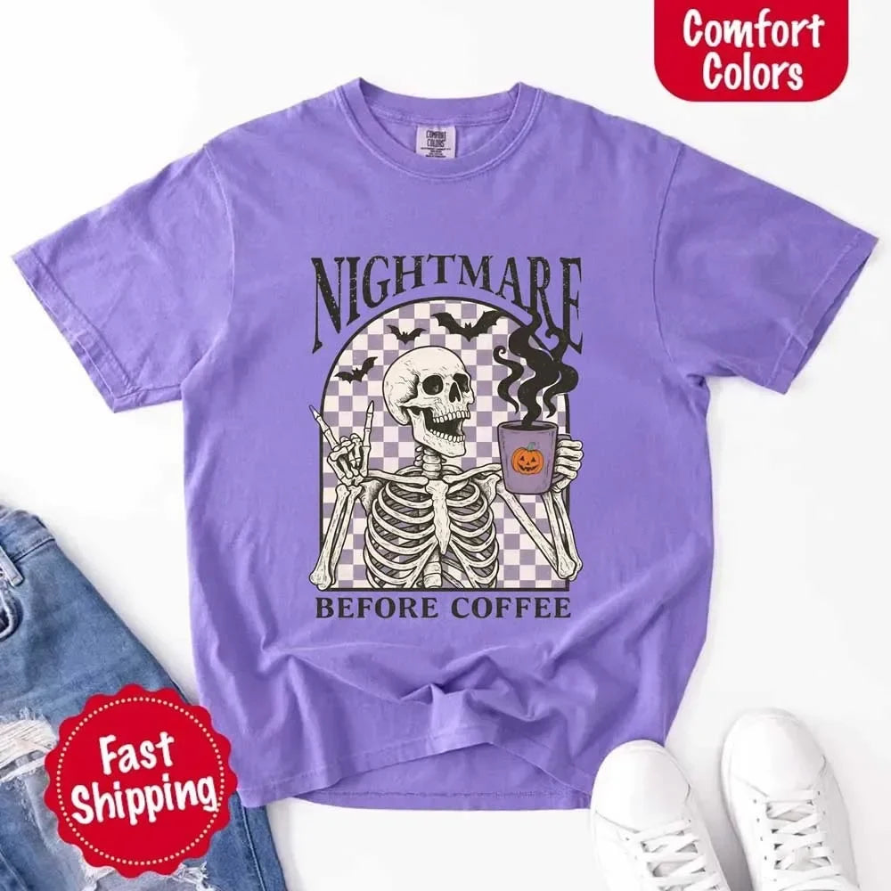Lavender crewneck T-shirt laid flat with skeleton coffee and pumpkin cup graphic