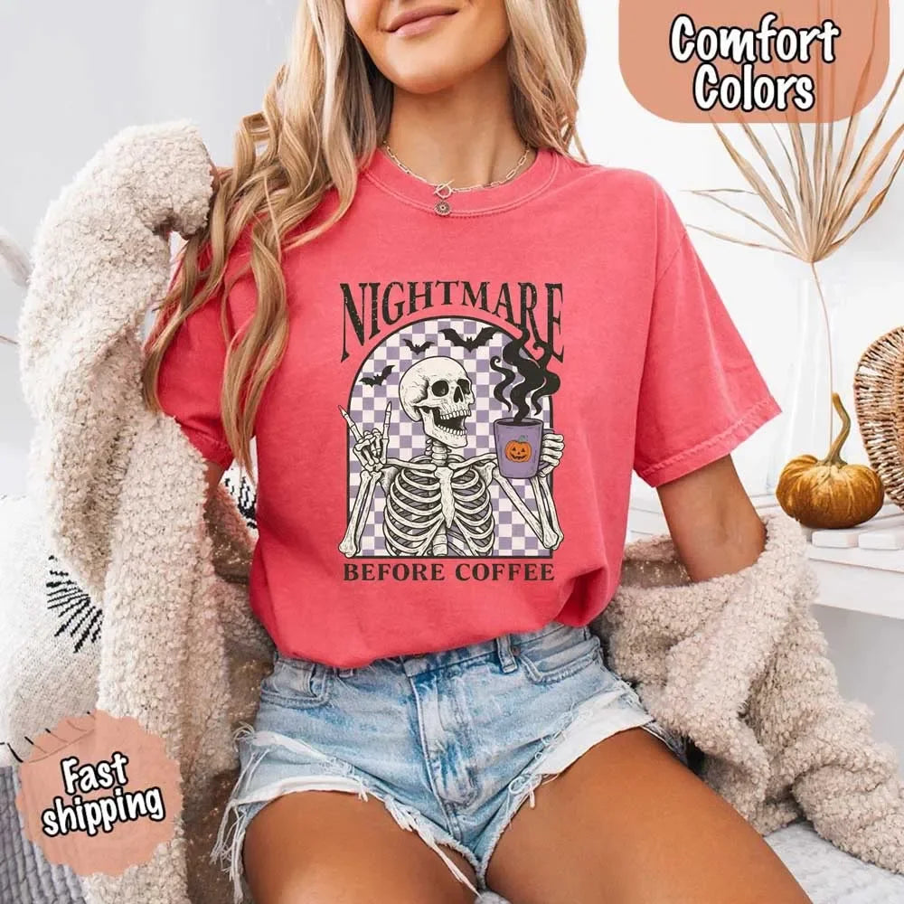 Coral/red T-shirt with skeleton “Before Coffee” graphic and jack-o’-lantern cup