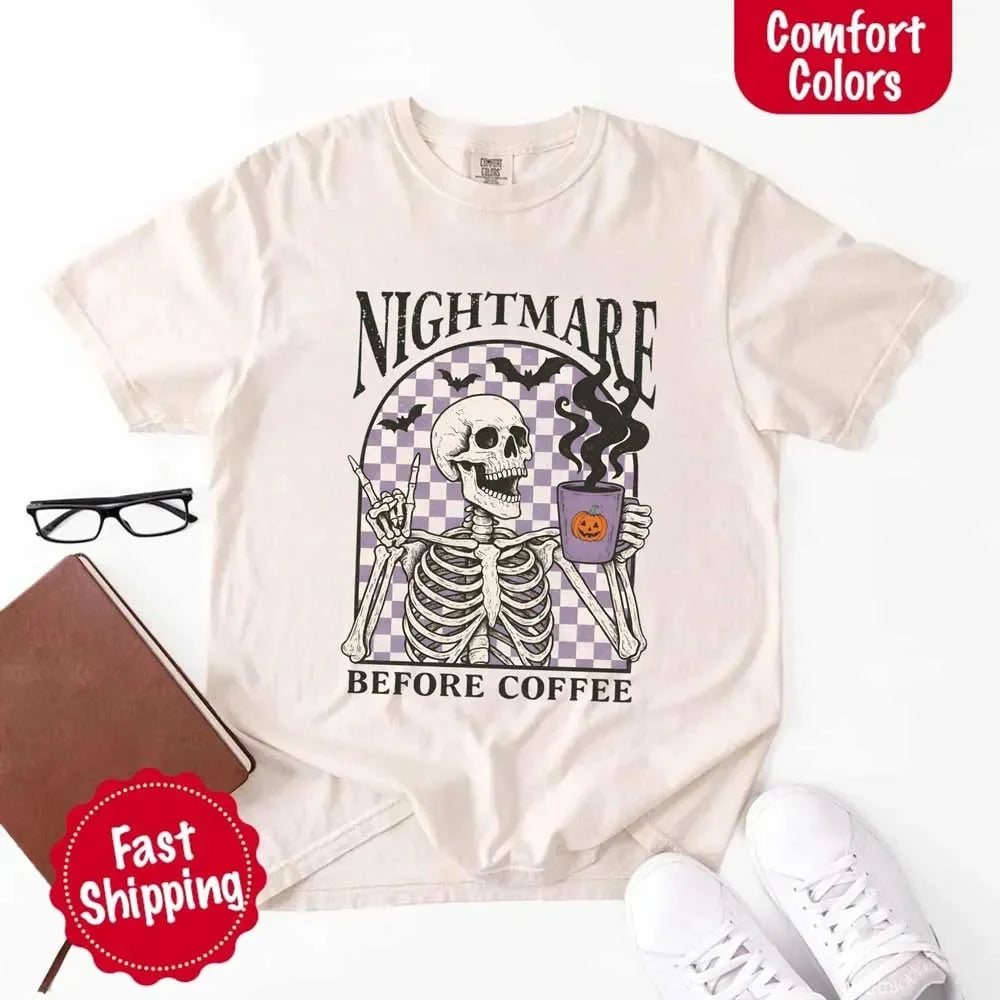 White T-shirt flat lay with skeleton “Nightmare Before Coffee” front graphic and fast shipping badge