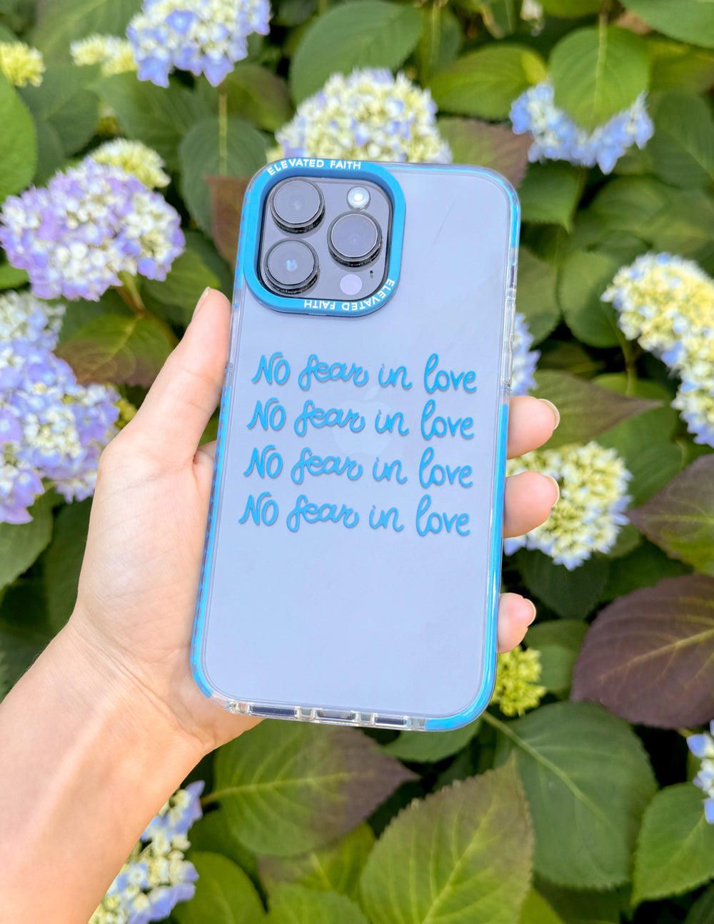 Blue transparent phone case with 'No fear in love' script and dual camera cutout