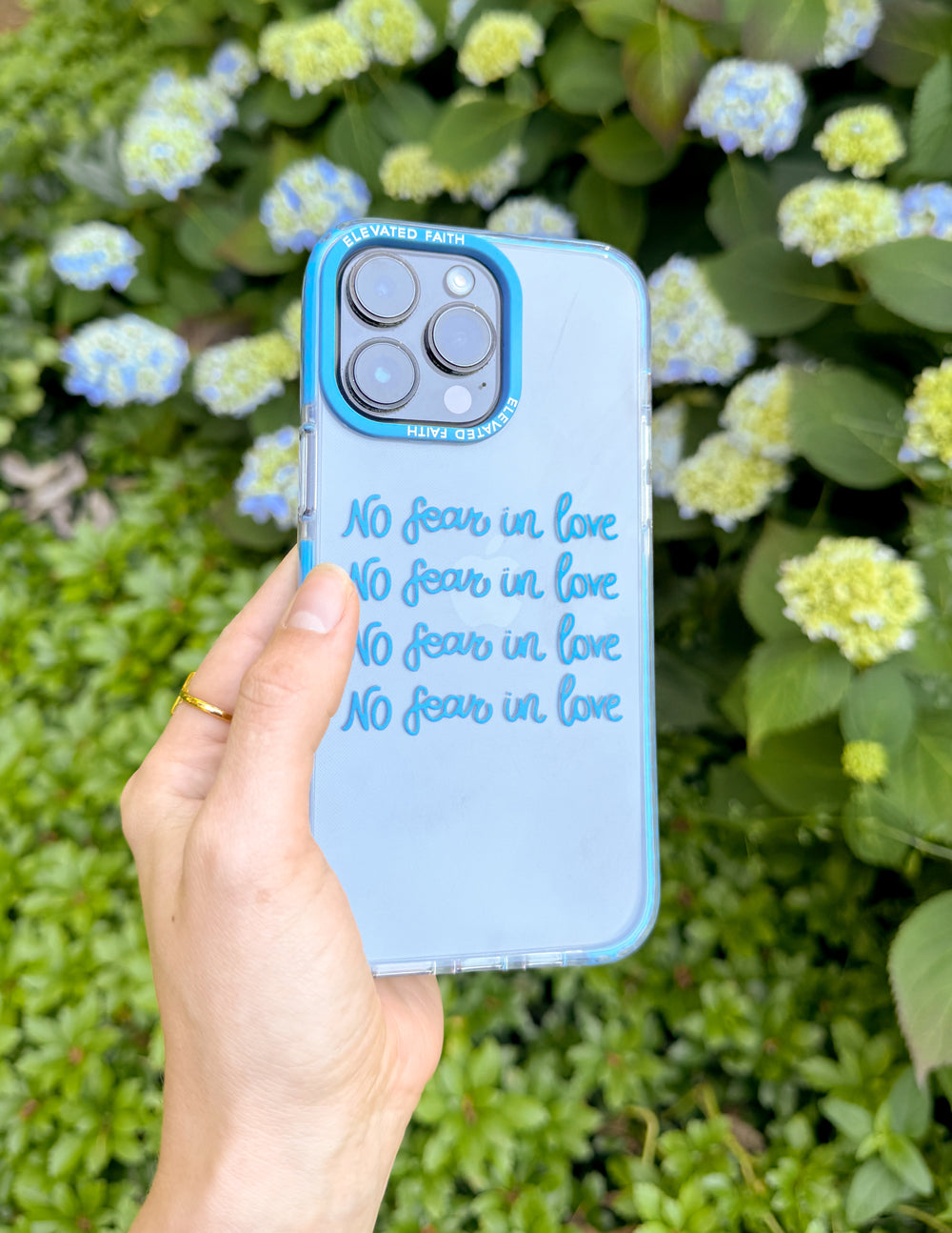 Blue transparent phone case back with 'No fear in love' script and camera cutouts