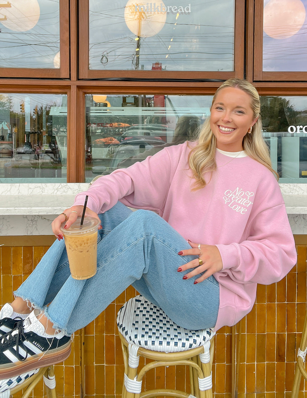 Pink unisex crewneck sweatshirt with small chest logo print, long sleeves and ribbed neckline