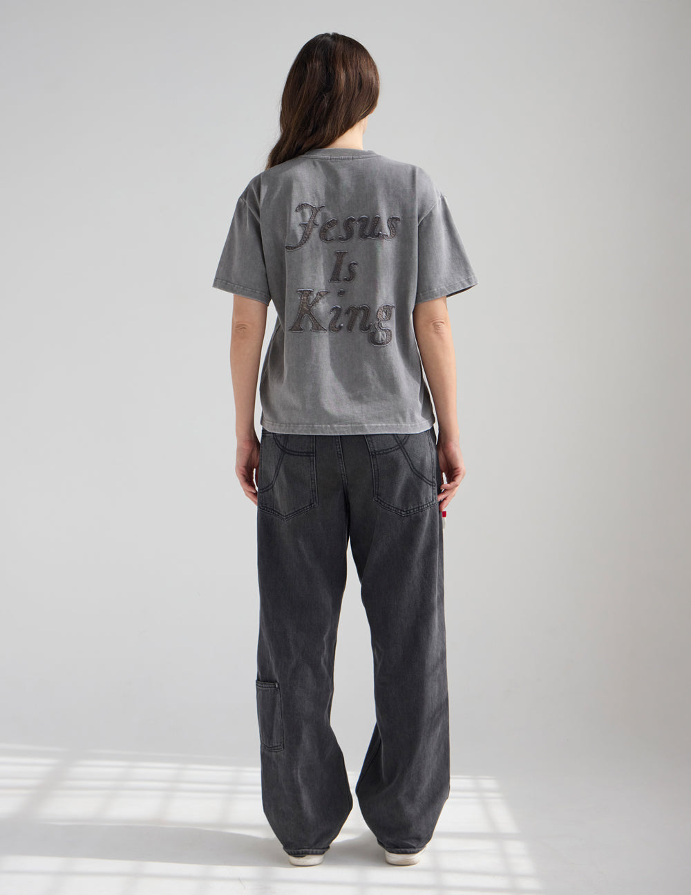 Back of heavyweight T-shirt in dark gray with large 'Jesus Is King' print