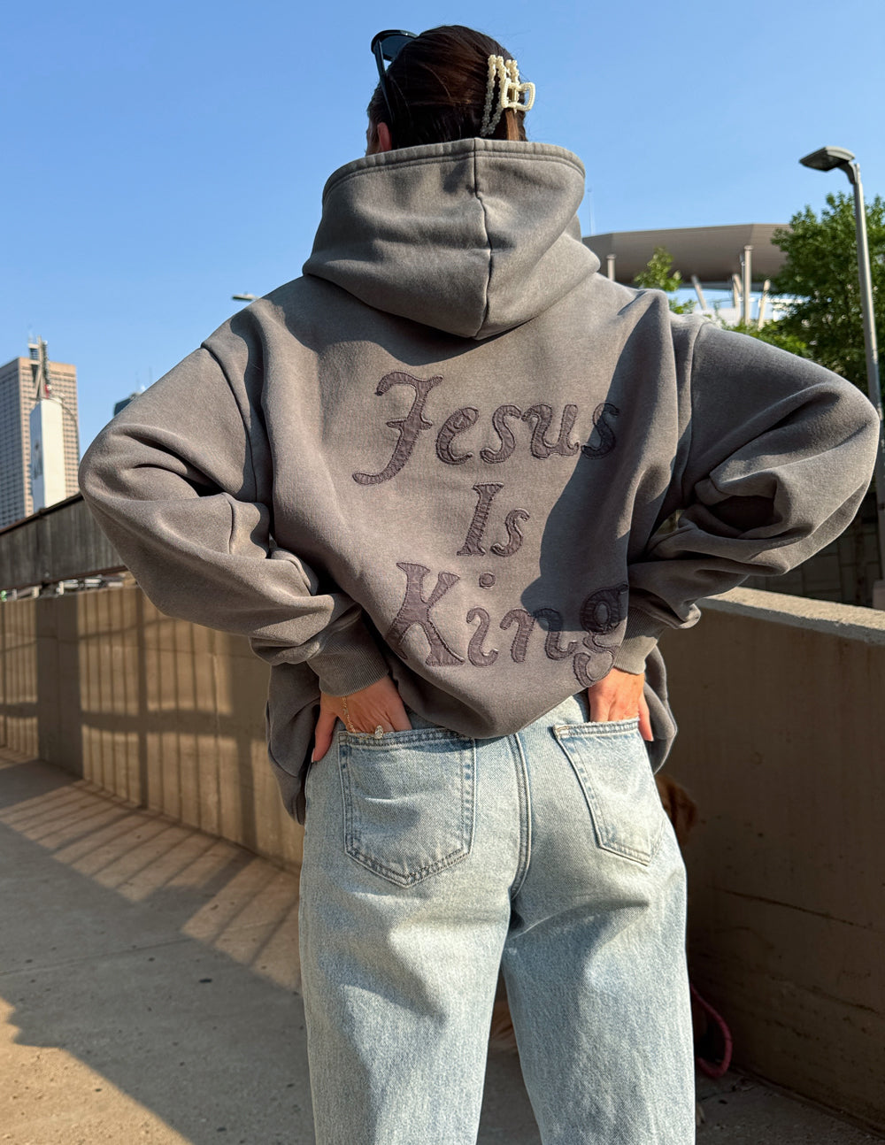 Gray unisex hoodie with large back and front script “Jesus Is King” print