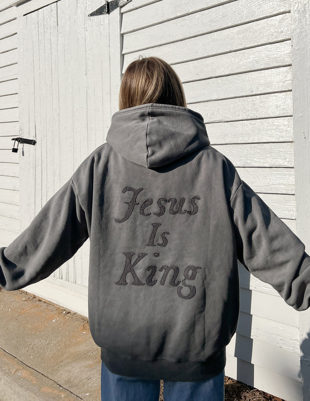 Gray unisex hoodie with large back “Jesus Is King” script print