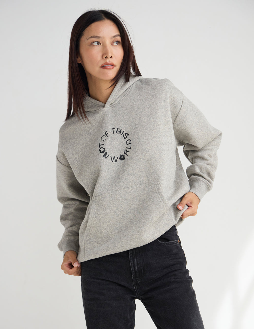 Light beige unisex hoodie with hood and centered circular logo, relaxed fit