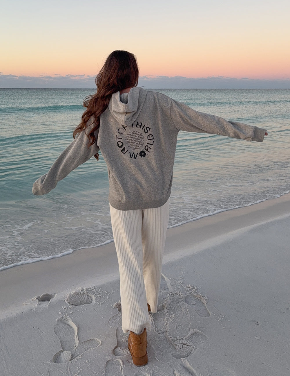 Light beige unisex hoodie, hooded back with circular logo graphic, long sleeves