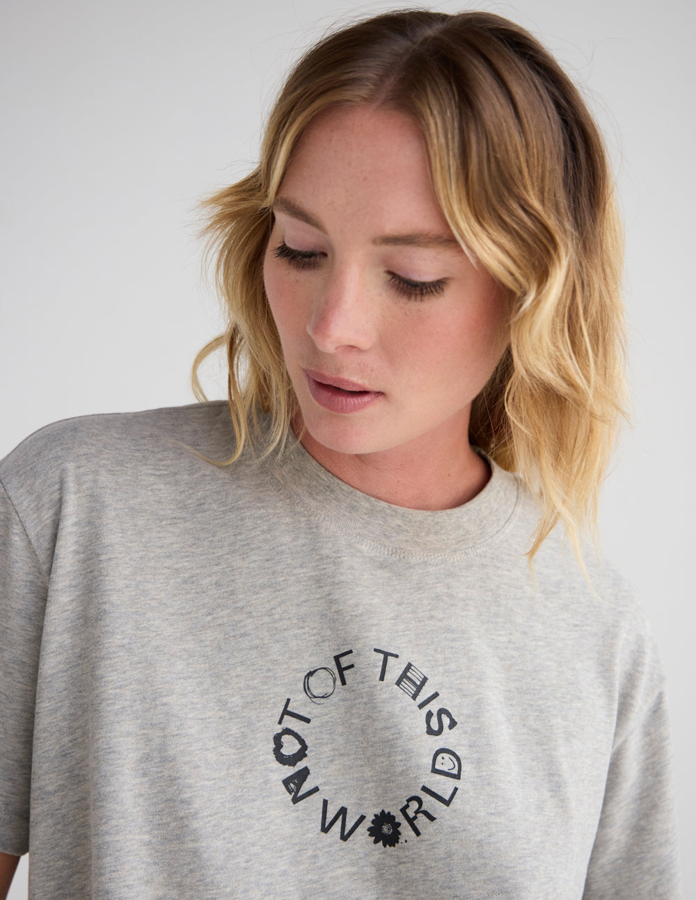 Heather gray unisex graphic T-shirt with crew neck and circular front text print