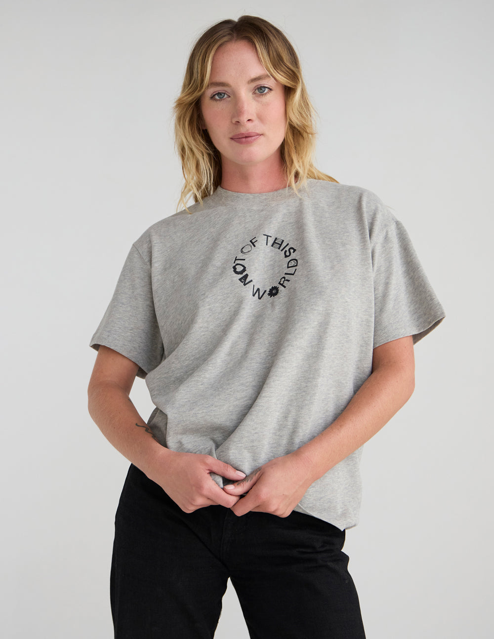 Unisex heather gray graphic T-shirt with crew neck and front circular text logo