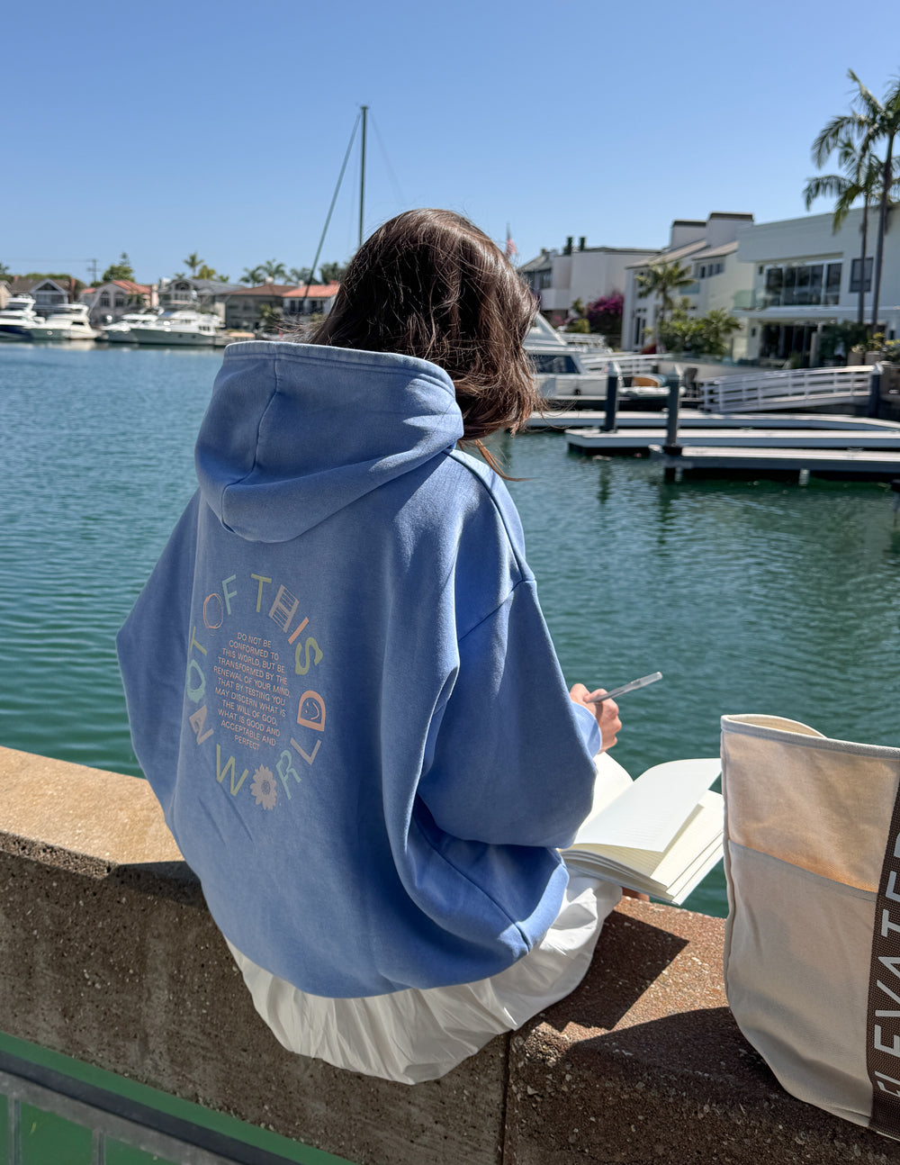 Blue unisex pullover hoodie with large back graphic and hood