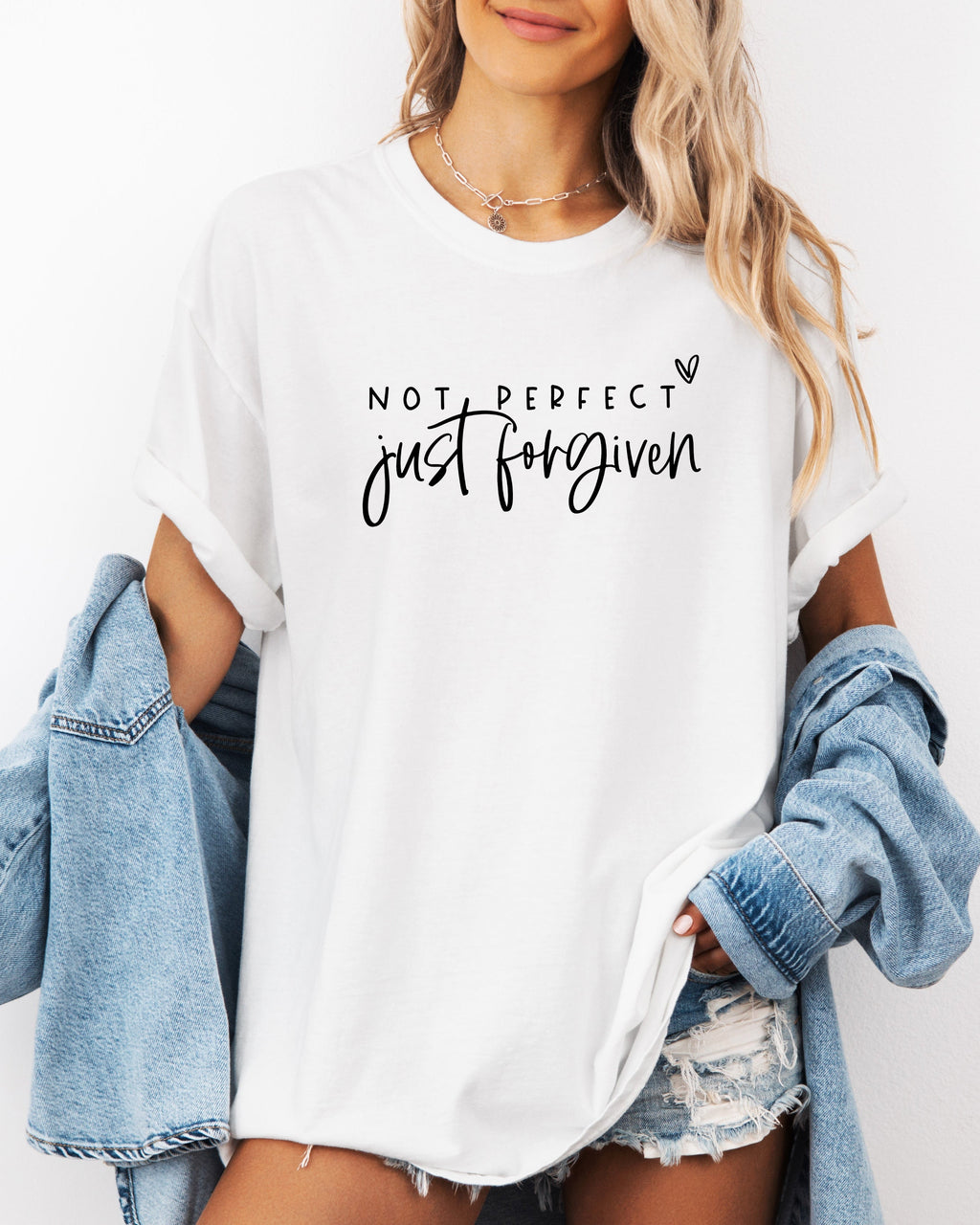White unisex T-shirt with crew neck and 'Not perfect, just forgiven' script graphic